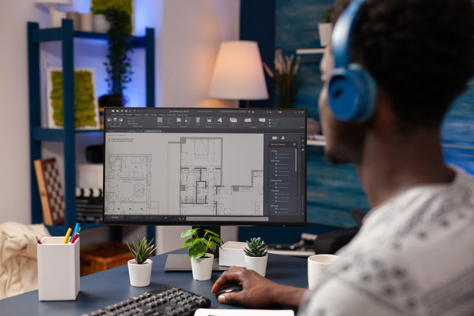 African american architect worker sitting at desk in living room
